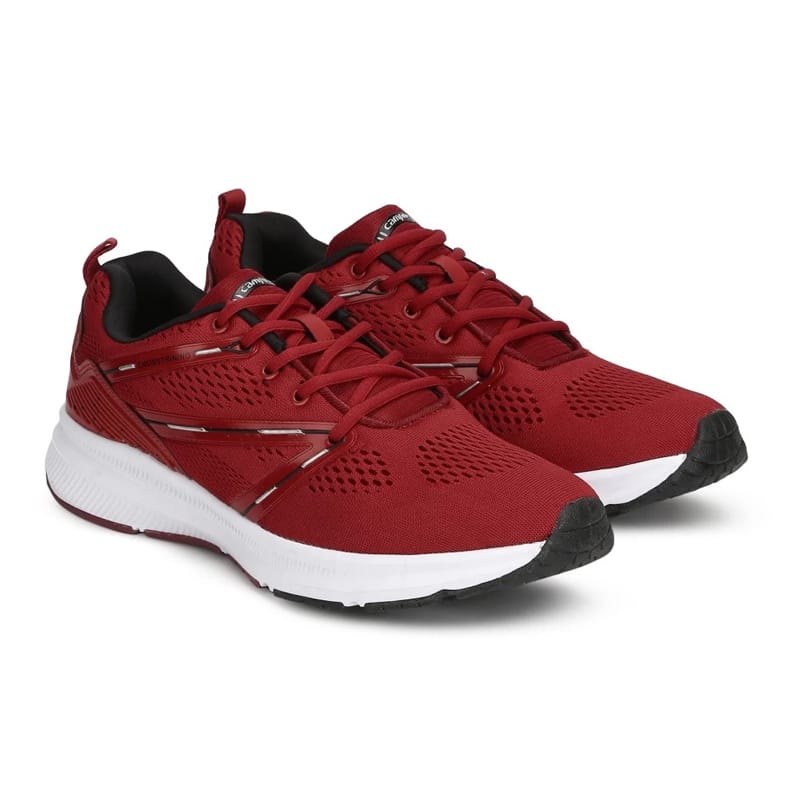 A screenshot of a real pair of sport shoes. A pair of red athletic sneakers with white midsoles, black outsoles, and black interior lining. The shoes feature mesh-like material and lace-up closures, positioned side by side on a white background.